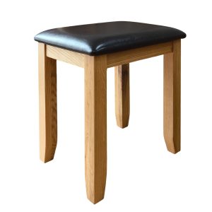 čalúnená masívna taburetka